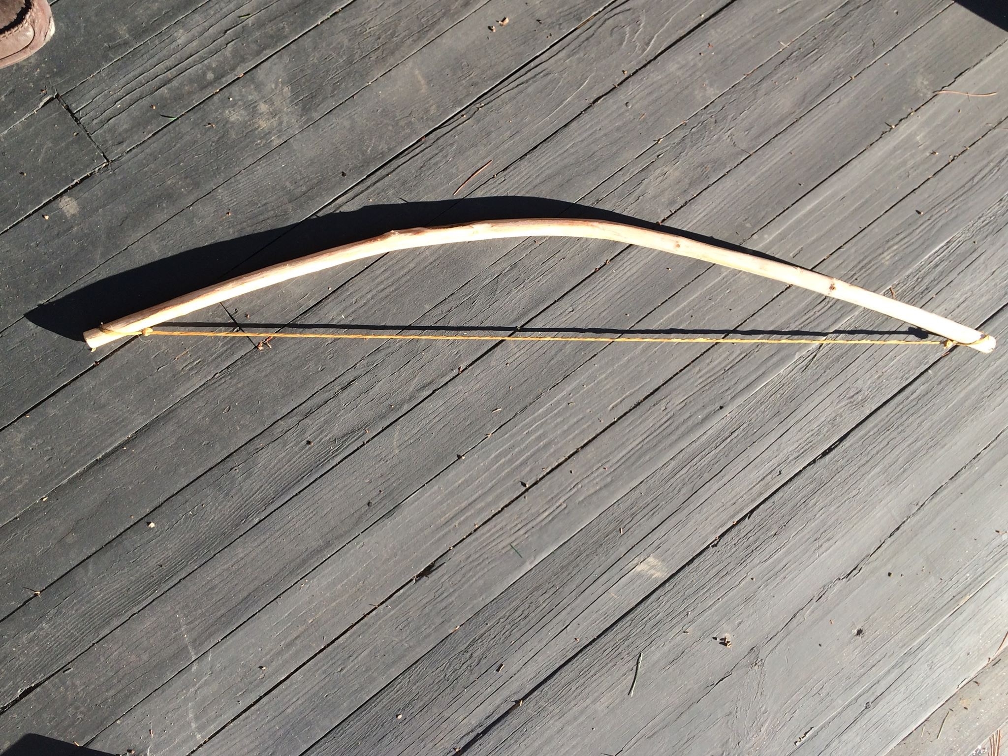 A small bow made from a sapling limb.